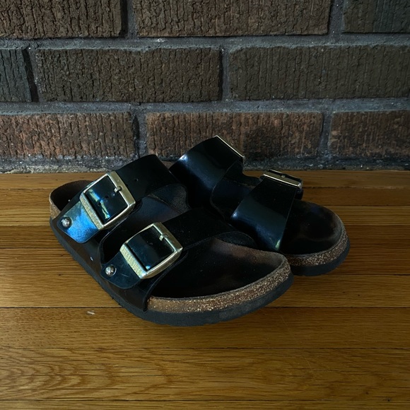 black patent birkenstocks with gold buckle
